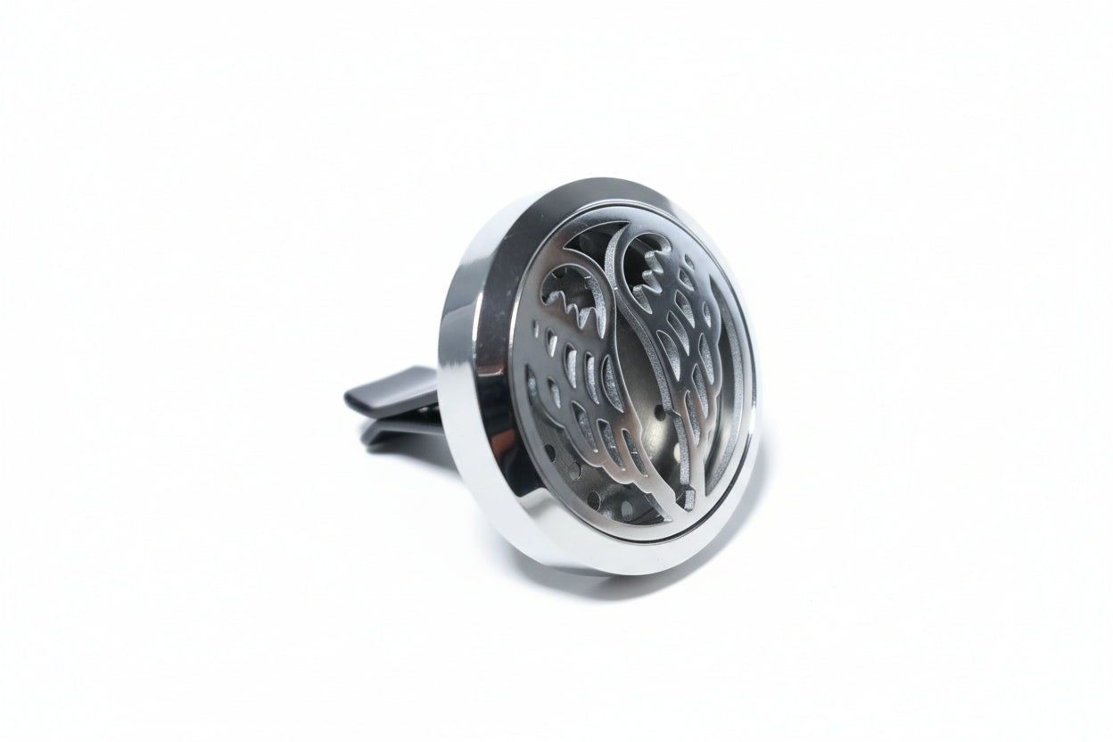 Metallic car air freshener with decorative design 