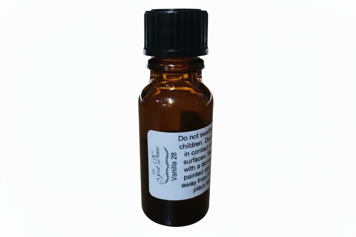 Small brown glass bottle with a black cap on a wooden surface