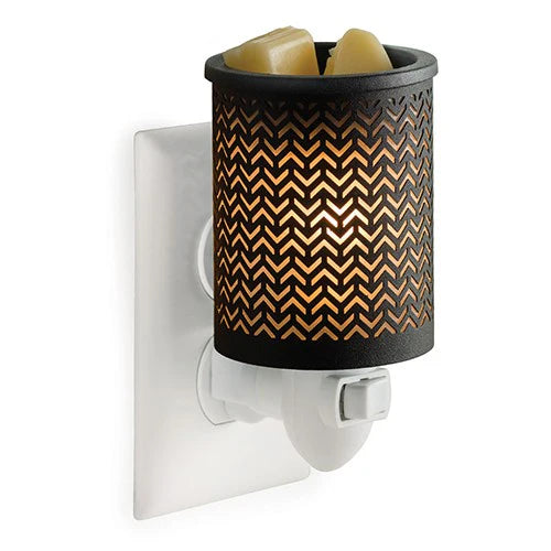 Wall-mounted wax warmer with chevron pattern on a white background